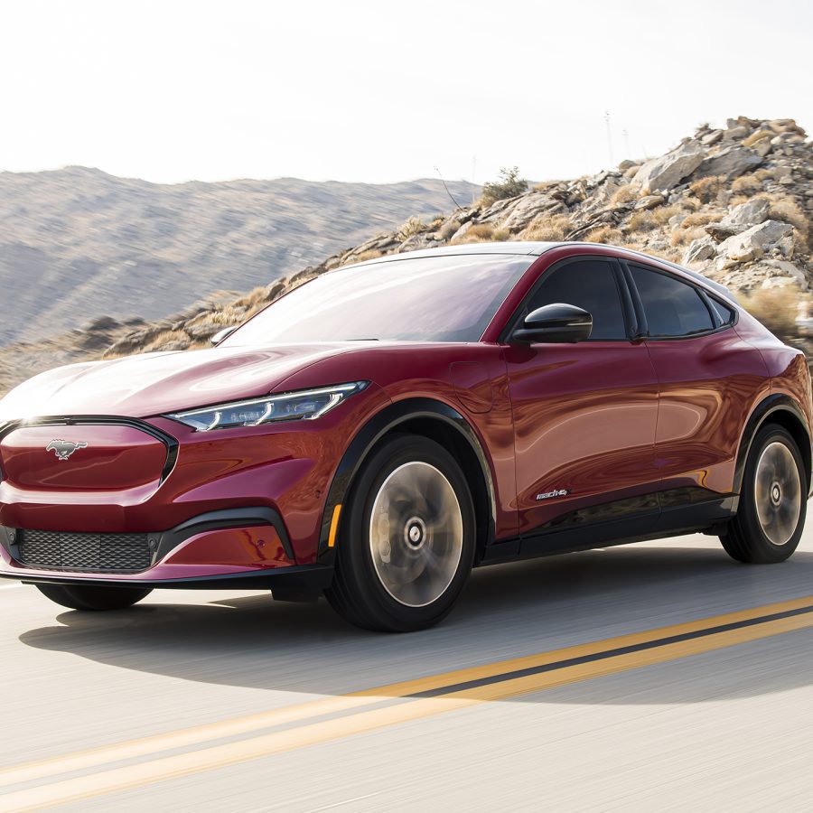 Three-quarter front view of a 2023 Ford red Mustang Mach e