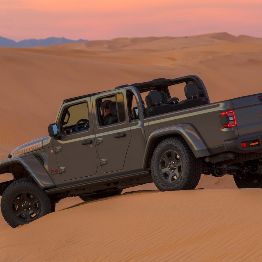 Side angle of a 2023 grey Jeep Gladiator Mojave