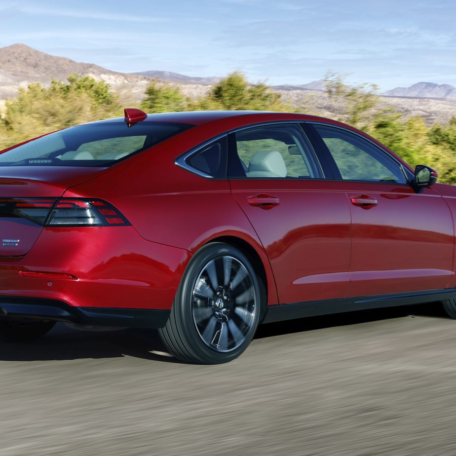 Three-quarter rear view of a 2023 red Honda Accord hybrid