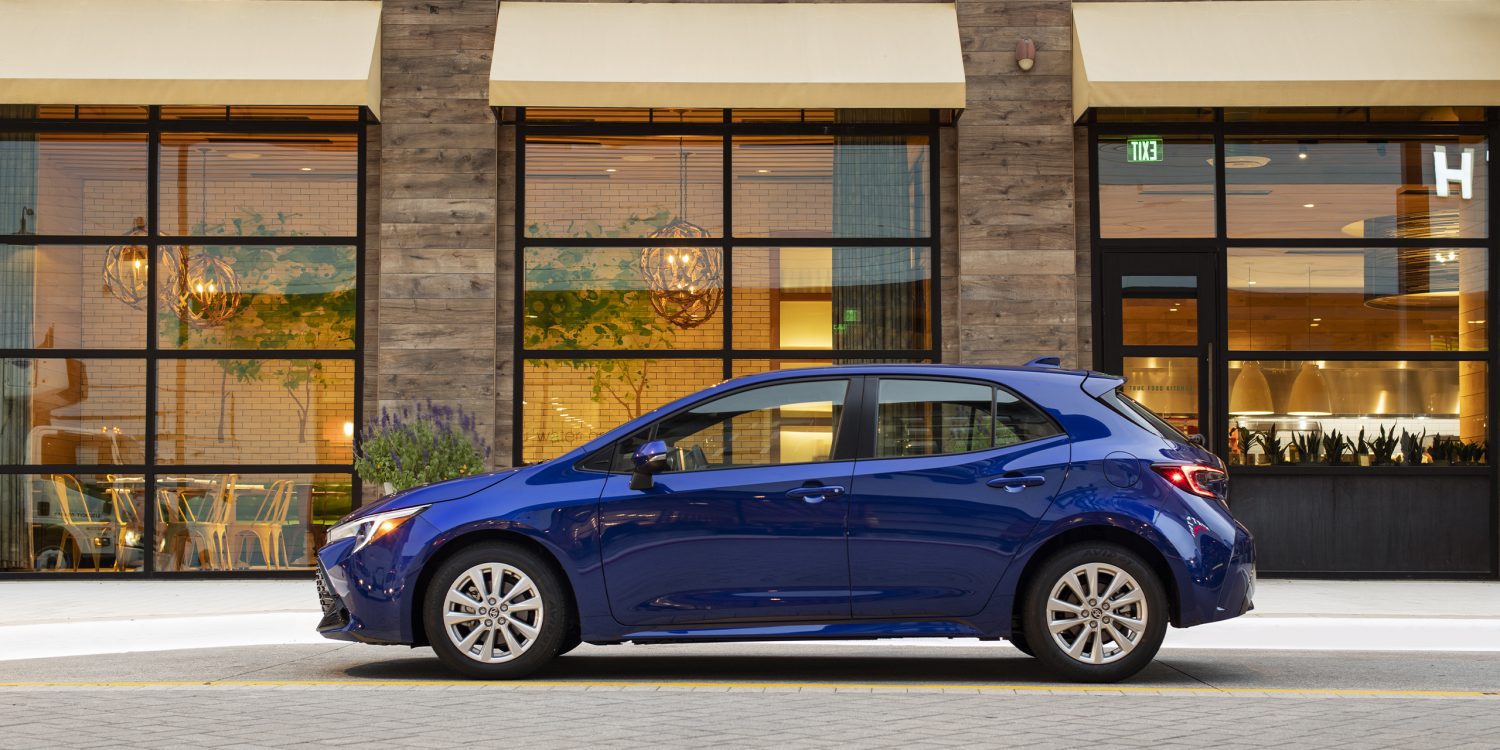 Side view of a 2023 blue Toyota Corolla hatchback