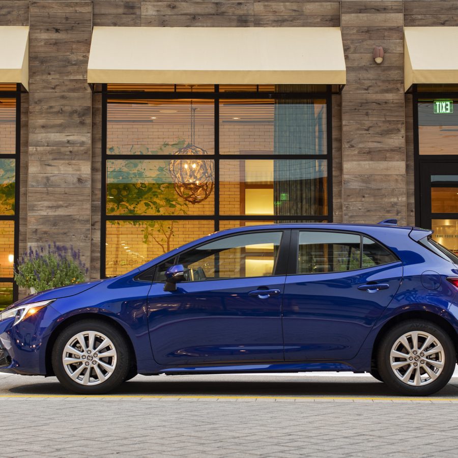 Side view of a 2023 blue Toyota Corolla hatchback