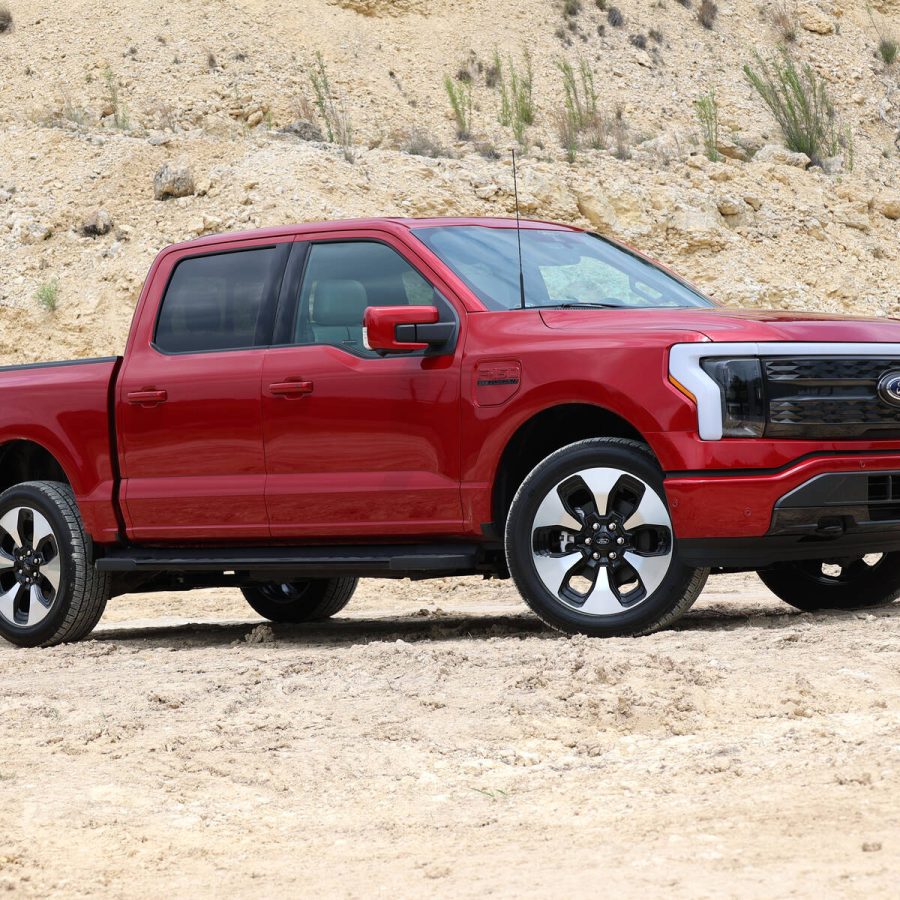 front angled view of a red Ford F-150 Lightning