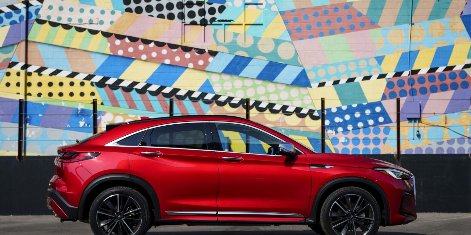 Side view of a 2024 red Infiniti QX55