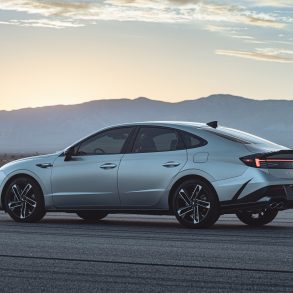 Three-quarter side view of a 2024 Hyundai Sonata N Line with mountain background