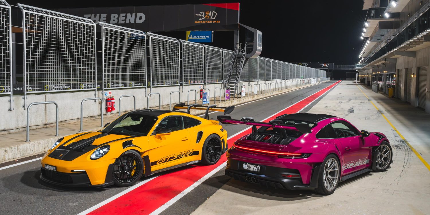 Image showing two 2024 Porsche 911 GT3 RS supercars, one in yellow and black and the other in purple.