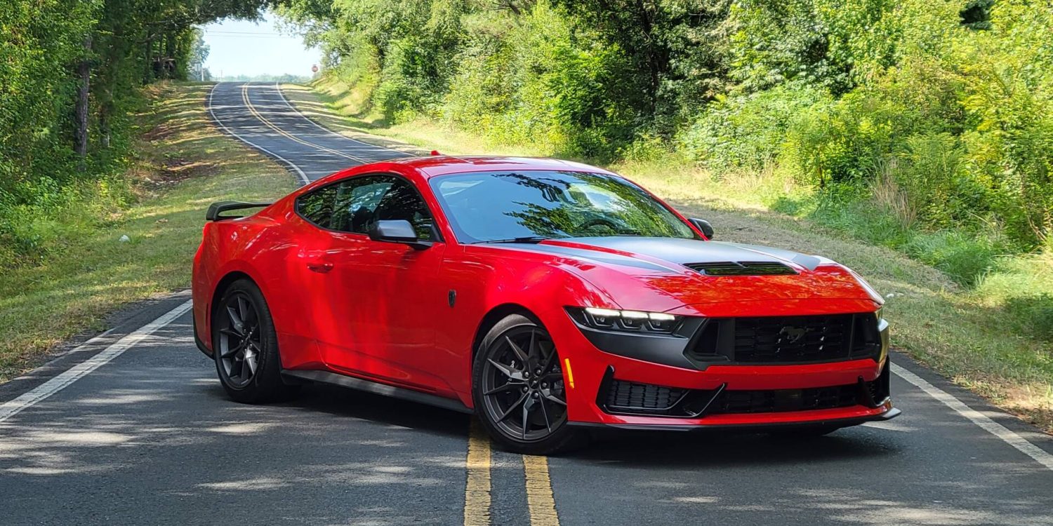 Front-angled view of a red Ford Mustang Dark Horse with black accents