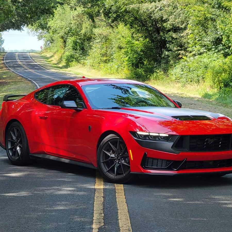 Front-angled view of a red Ford Mustang Dark Horse with black accents