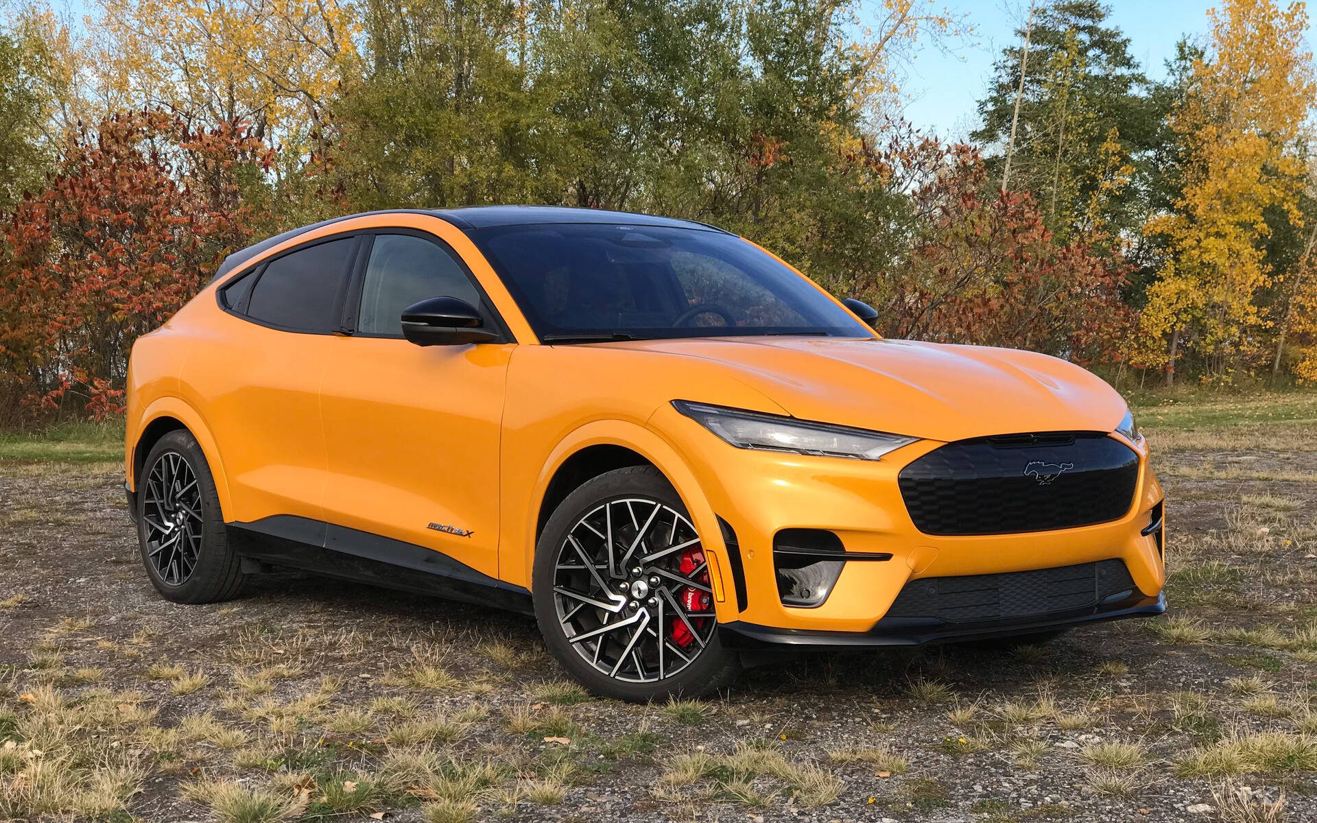 Front-angled view of an orange Ford Mustang Mach-E