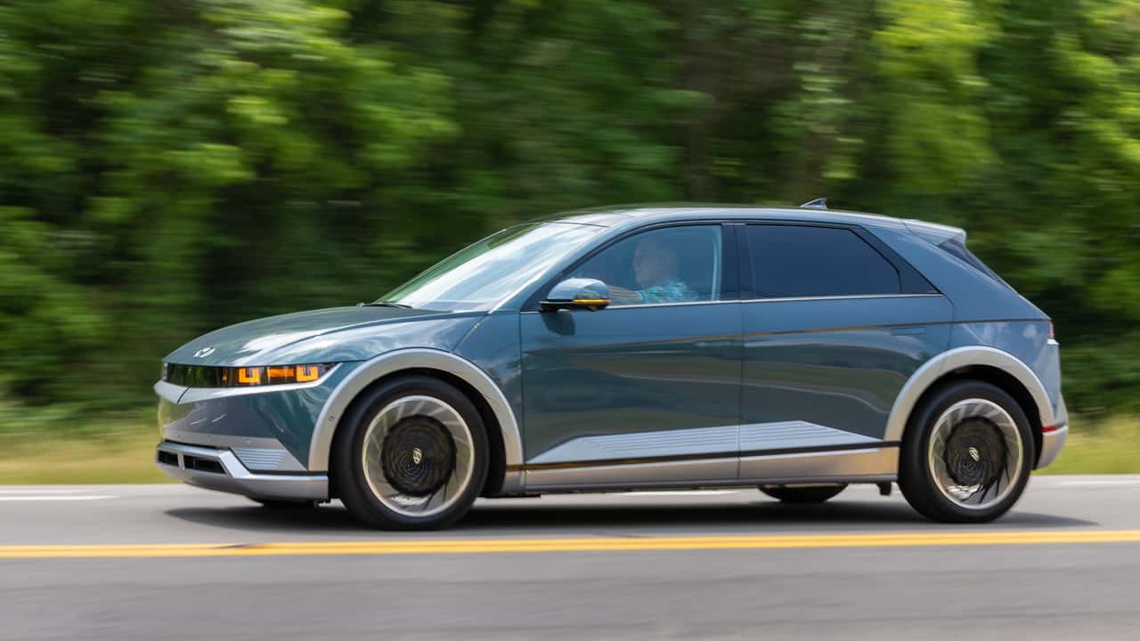 Rolling shot of a blue Hyundai Ioniq 5