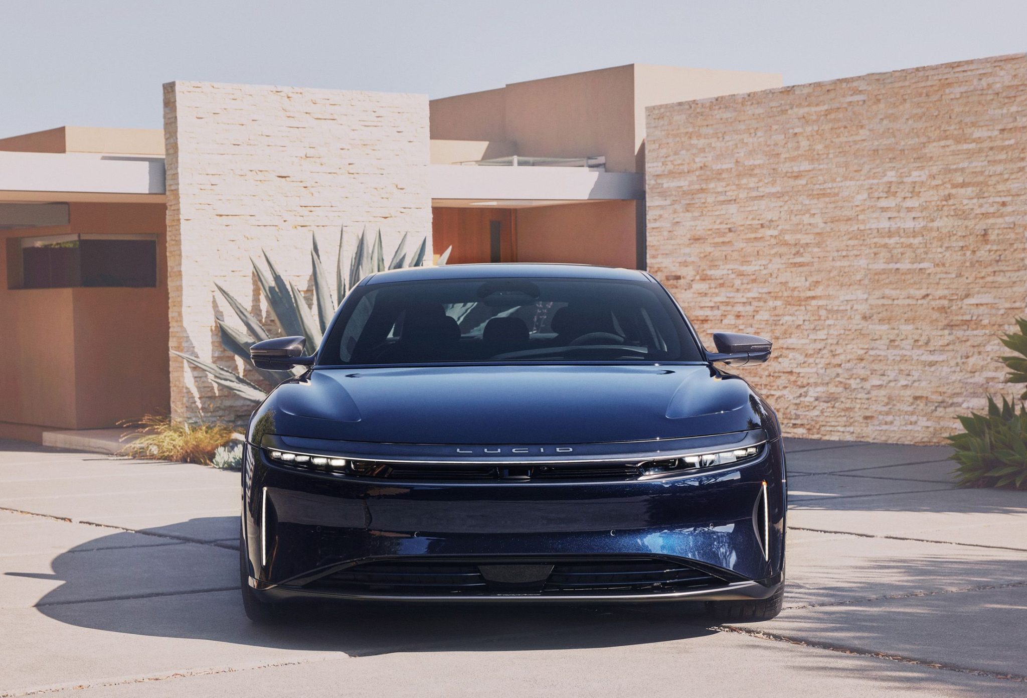 Frontal view of a dark blue 2024 Lucid Air Sapphire