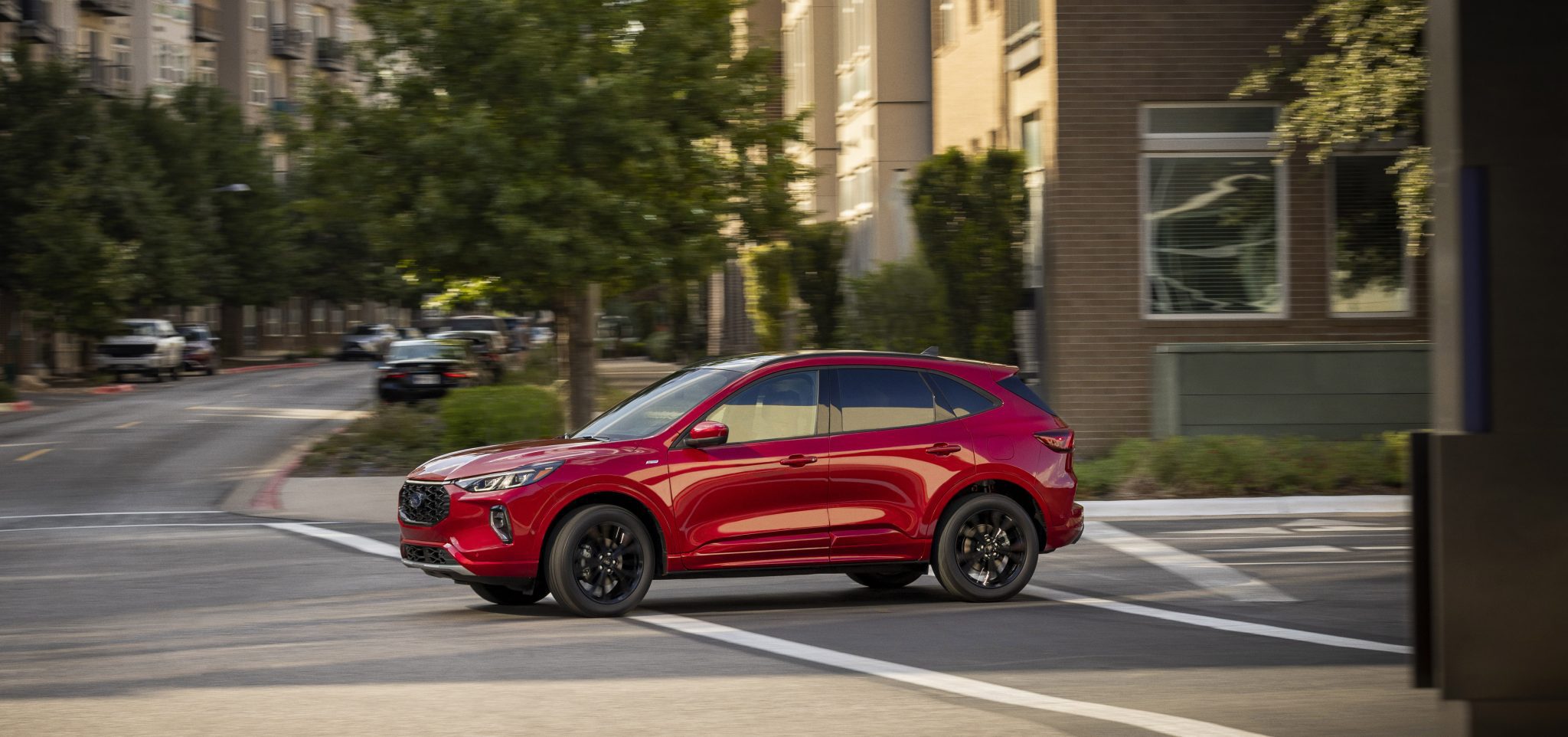 Side view of a 2024 red Ford Escape hybrid.