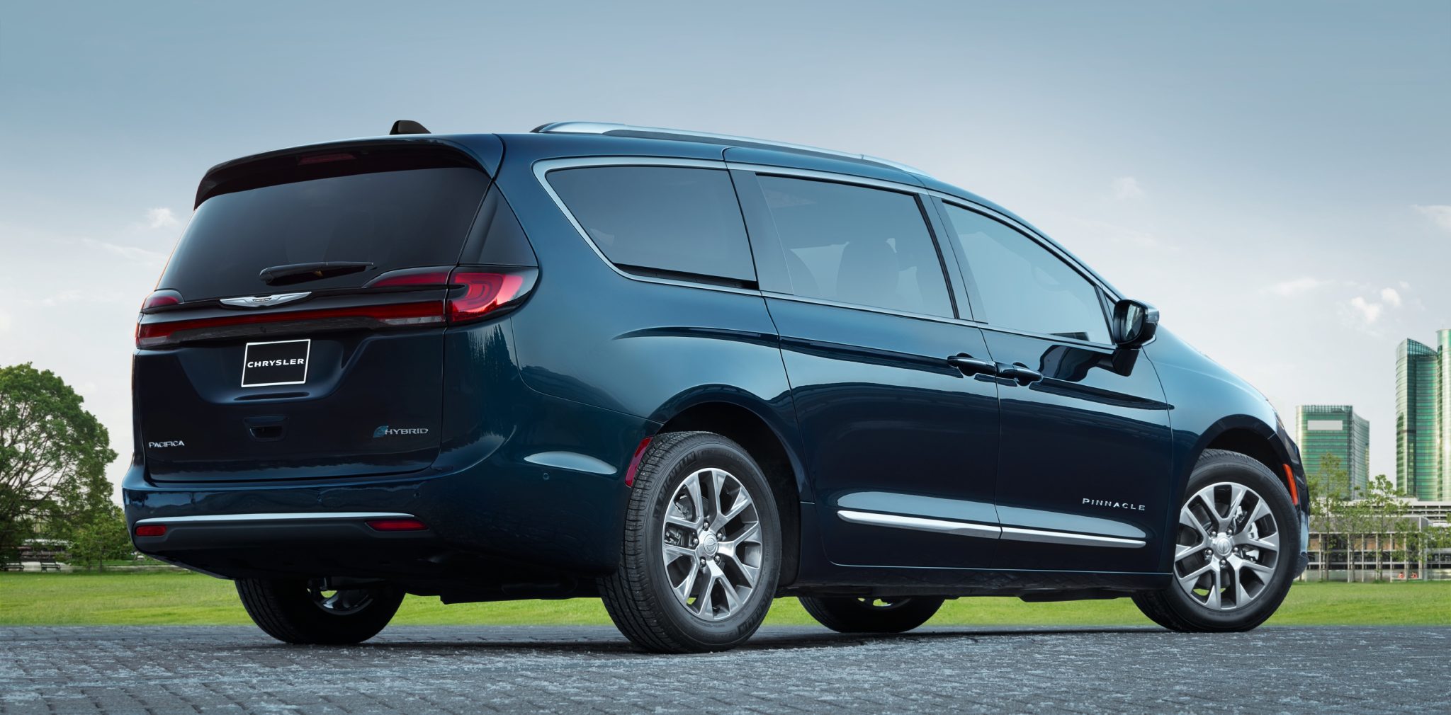 Three-quarter side view of a 2024 blue Chrysler Pacifica PHEV