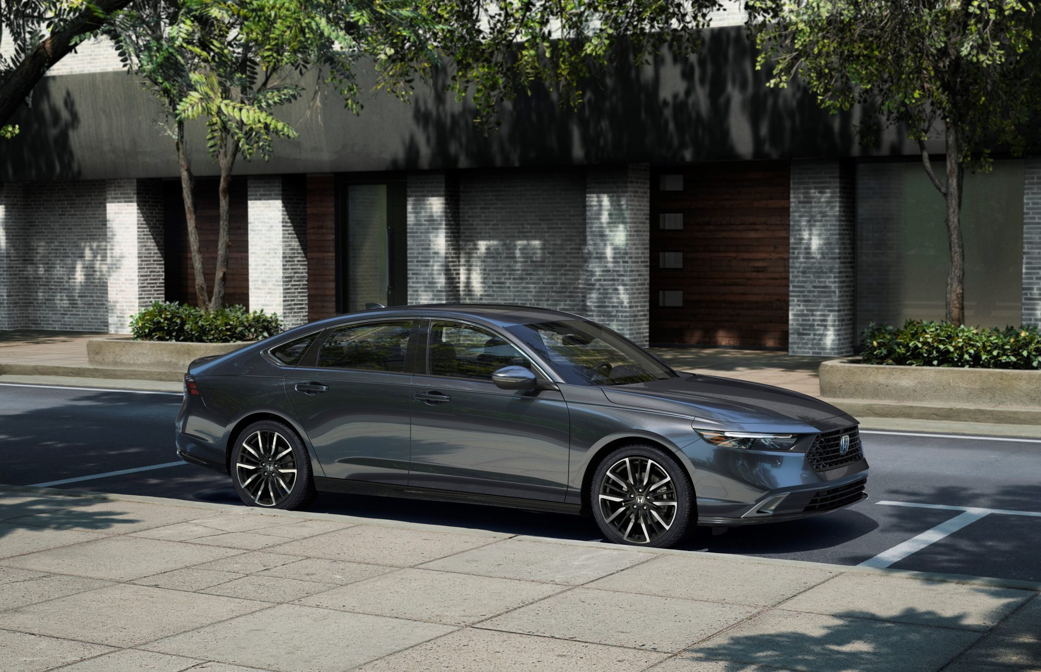 Side view of a 2024 grey Honda Accord on a city street