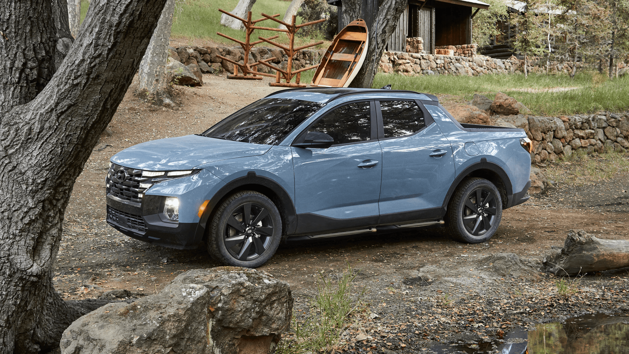 Side view of a 2024 blue Hyundai Santa Cruz