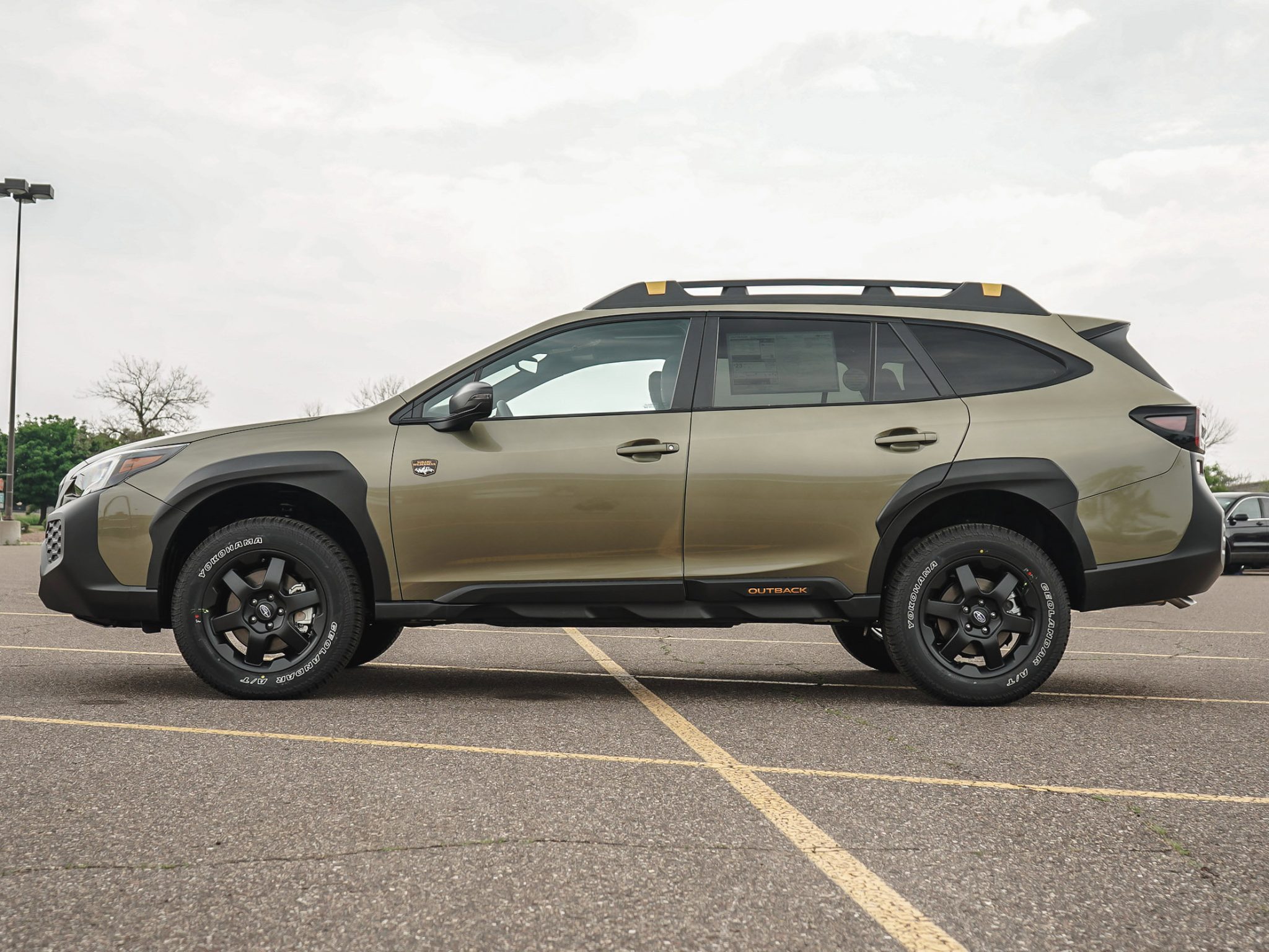 Side view of a 2024 bronze Subaru Outback 