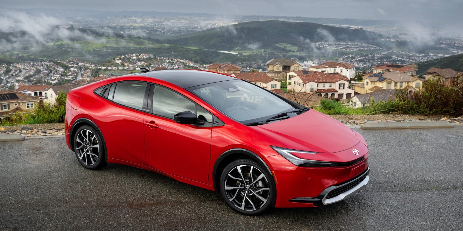 3/4 side view of a 2024 red Toyota Prius Prime