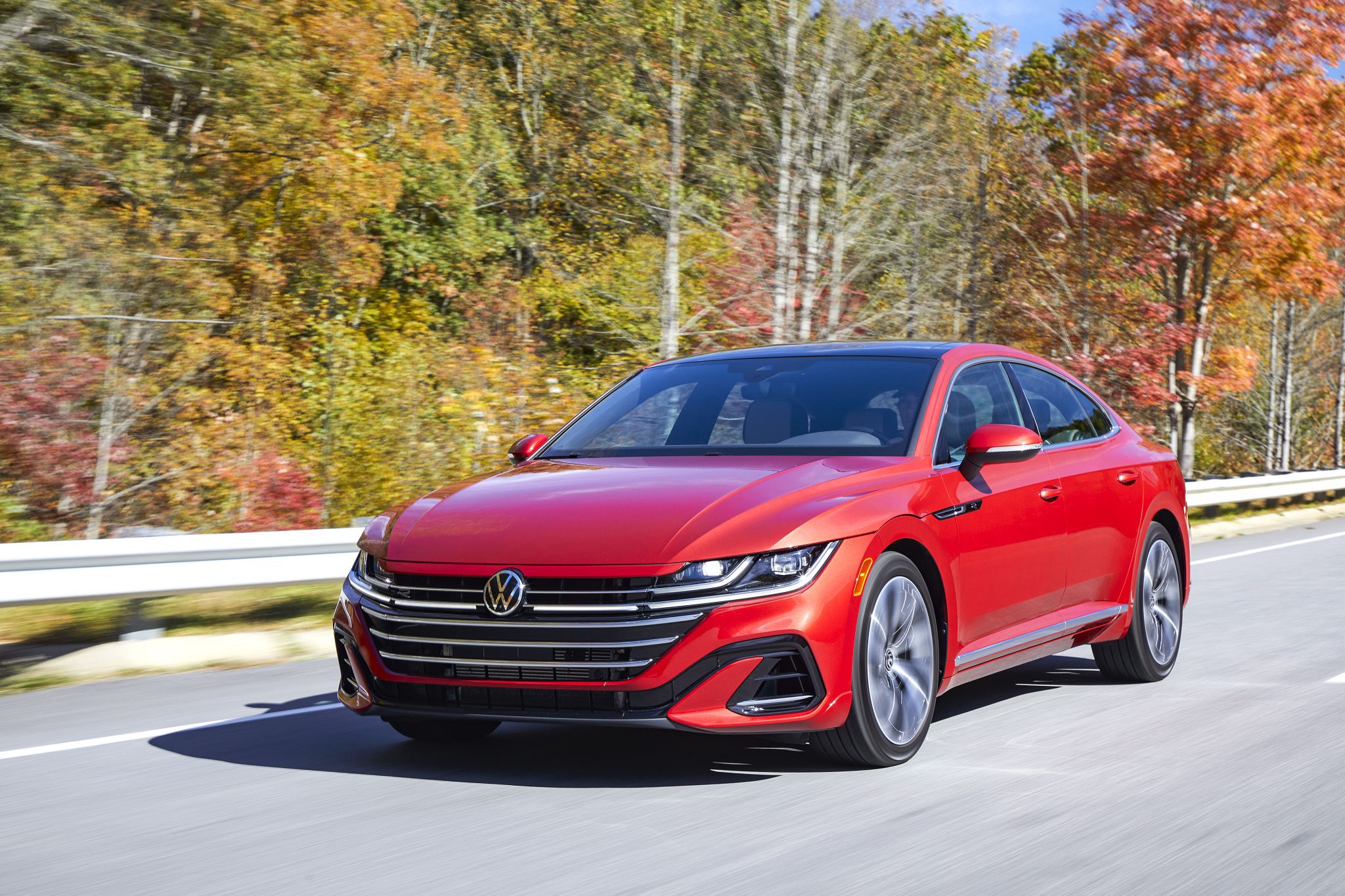 Front view of a 2024 red VW Arteon on a backroad