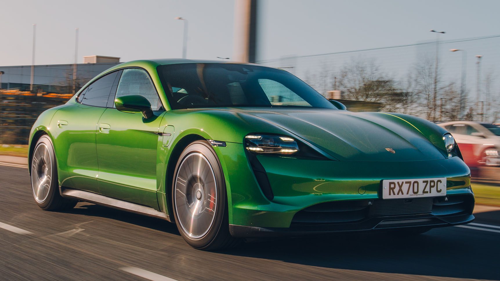 Front-angled view of a green Porsche Taycan 4S